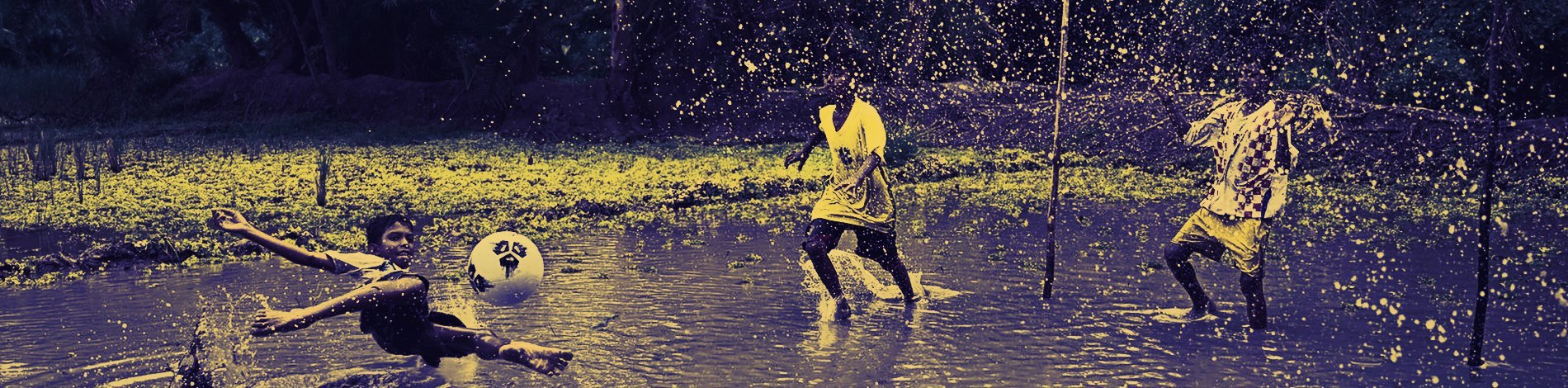 A match played on a flooded ground in rural West Bengal, water up to the players’ shins.